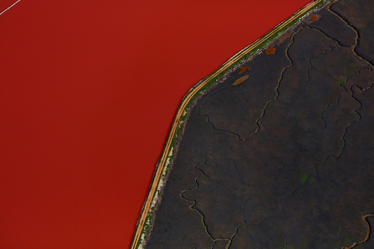 Aerial photography from a doorless R22 helicopter over the San Francisco Bay Cargill Salt Ponds. Limited & open edition fine art prints available for purchase.