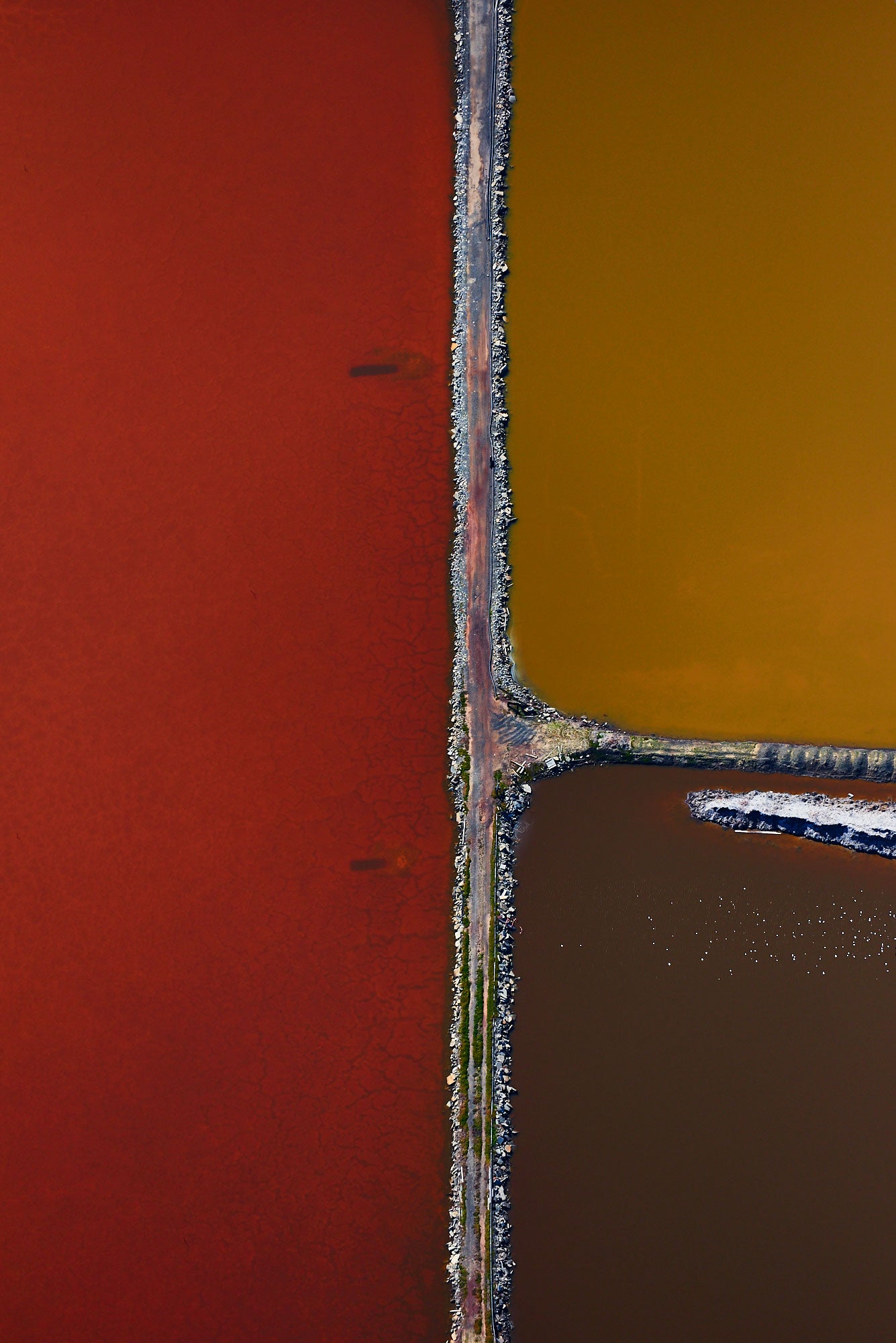 Aerial photography from a doorless R22 helicopter over the San Francisco Bay Cargill Salt Ponds. Limited & open edition fine art prints available for purchase.