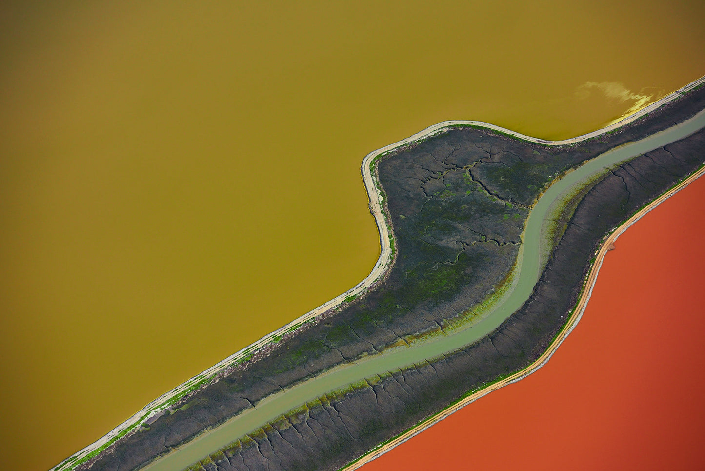 Aerial photography from a doorless R22 helicopter over the San Francisco Bay Cargill Salt Ponds. Limited & open edition fine art prints available for purchase.