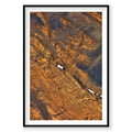 Aerial view of golden Icelandic mountains with snow patches from above, photography print by Remy Gerega