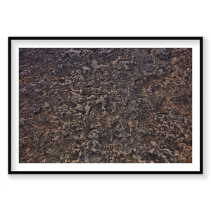 Aerial view of textured lava fields in Iceland with dark rocky terrain, photography print by Remy Gerega