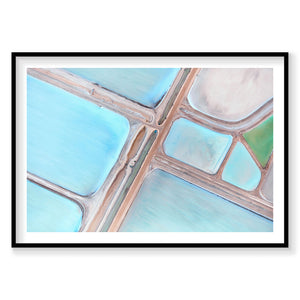 Aerial view of turquoise salt ponds and roads with geometric patterns from above, photography print by Remy Gerega