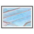 Aerial view of geometric blue salt evaporation ponds with brown dividing lines, photography print by Remy Gerega