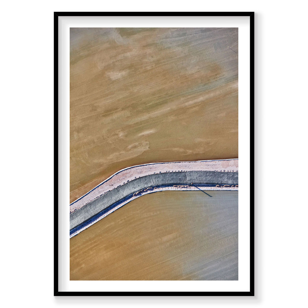 Aerial view of Moab phosphorus ponds with curved blue barrier and tan water, photography print by Remy Gerega
