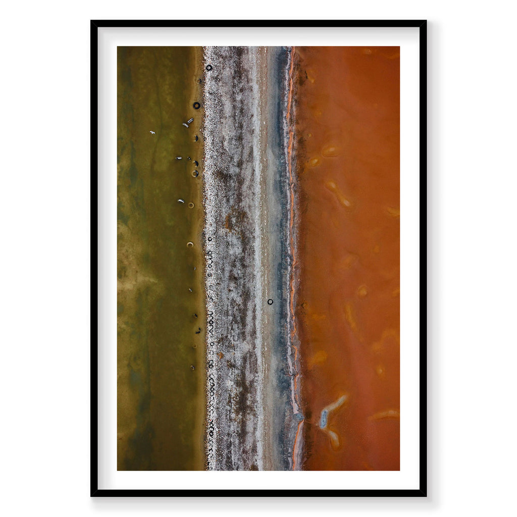 Aerial view of Tyre Pit at Great Salt Lake with golden and orange waters, photography print by Remy Gerega