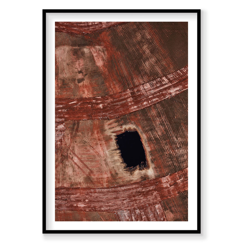 Aerial view of red topsoil and farmland with dark rectangular clearing, Western Australia, photography print by Remy Gerega