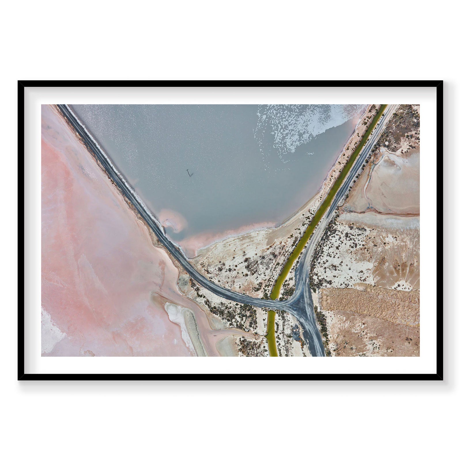 Aerial view of pink and blue waters at Great Salt Lake with winding road, photography print by Remy Gerega