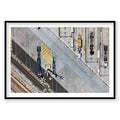 Aerial view of industrial port with blue cargo ships and yellow striped dock, photography print by Remy Gerega