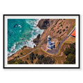 Aerial view of Byron Bay Lighthouse on clifftop with turquoise ocean below, photography print by Remy Gerega