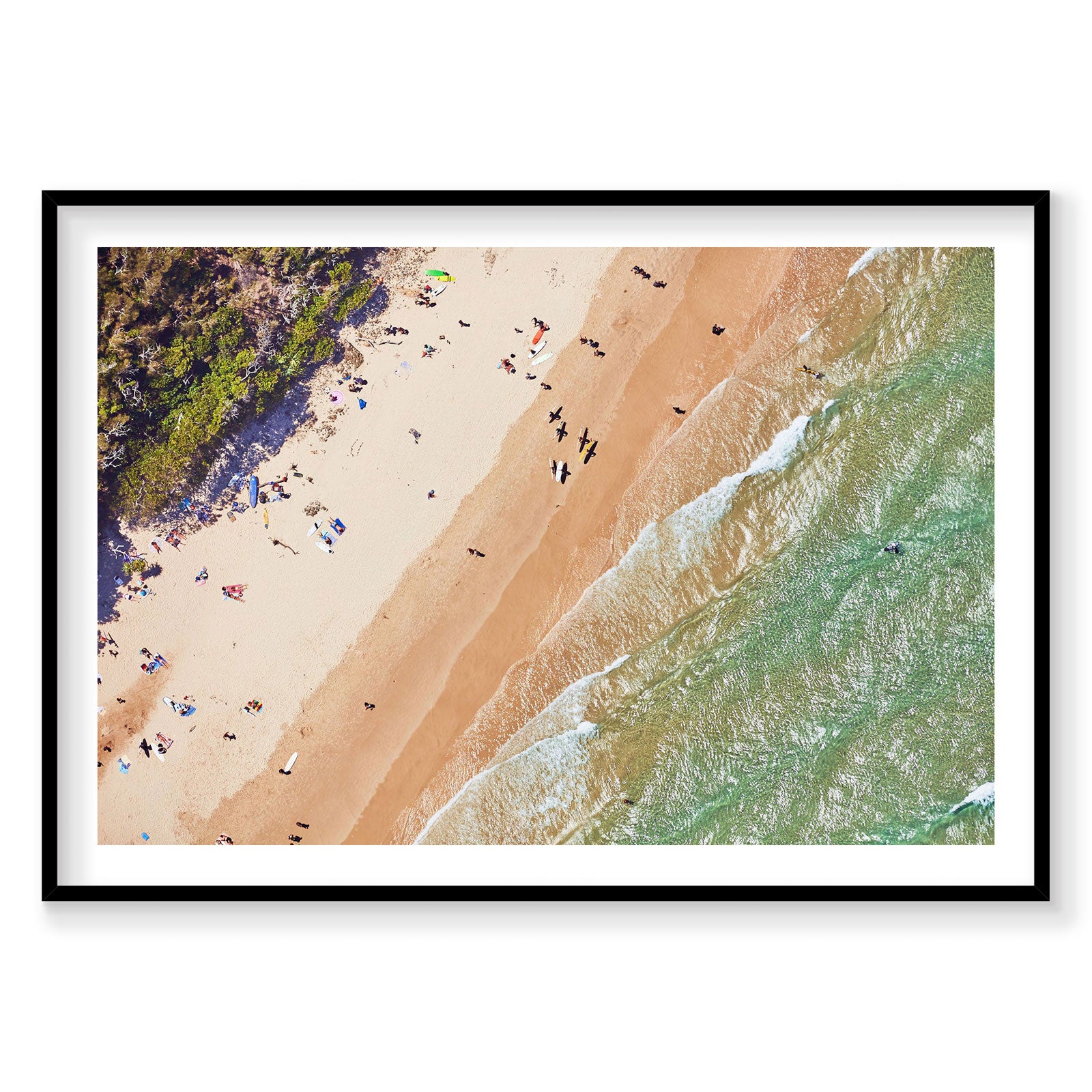 Aerial view of Main Beach Byron Bay with surfers and beachgoers, golden sand and turquoise waves, photography print by Rem...