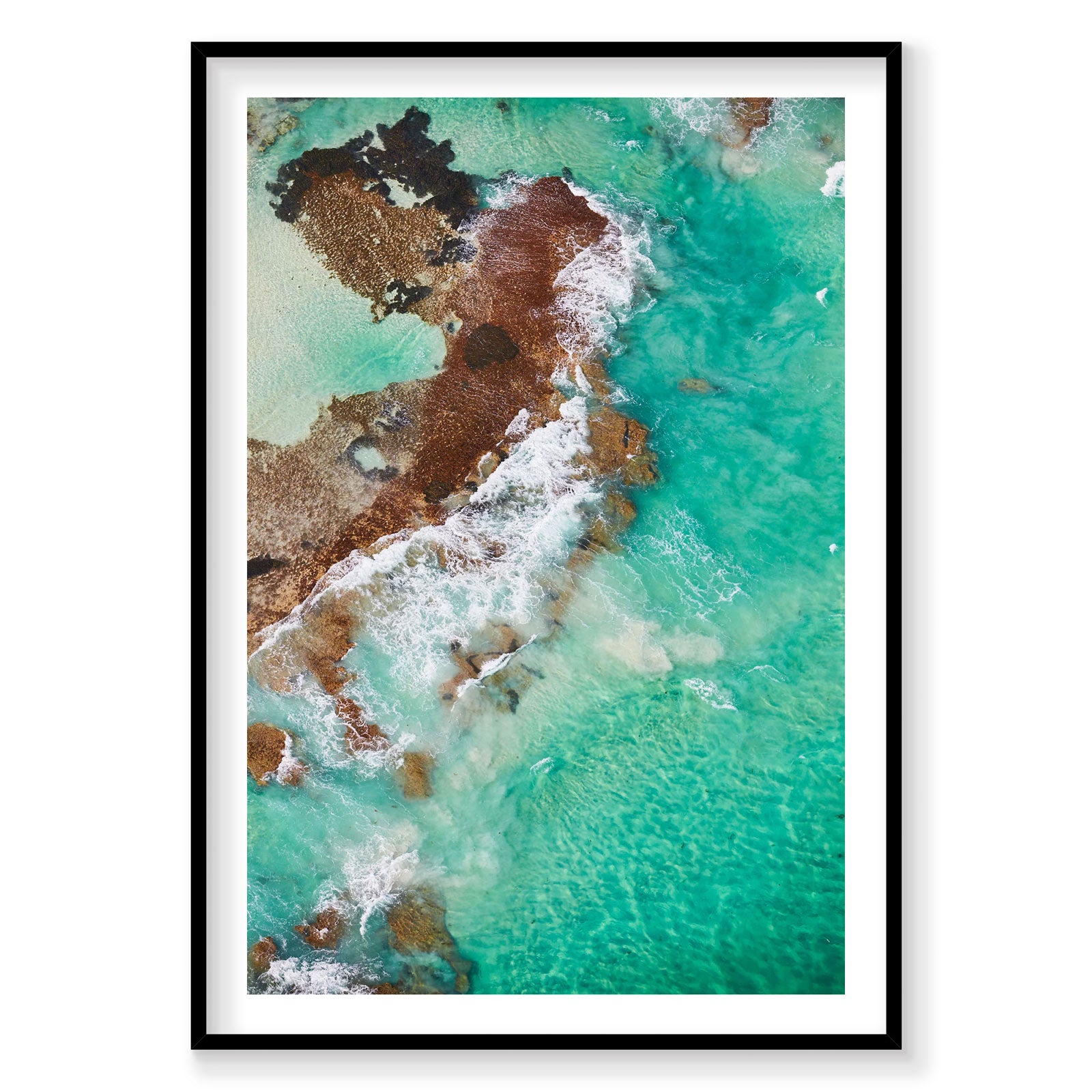 Aerial view of turquoise waves crashing on Rottnest Island sandstone cliffs, photography print by Remy Gerega