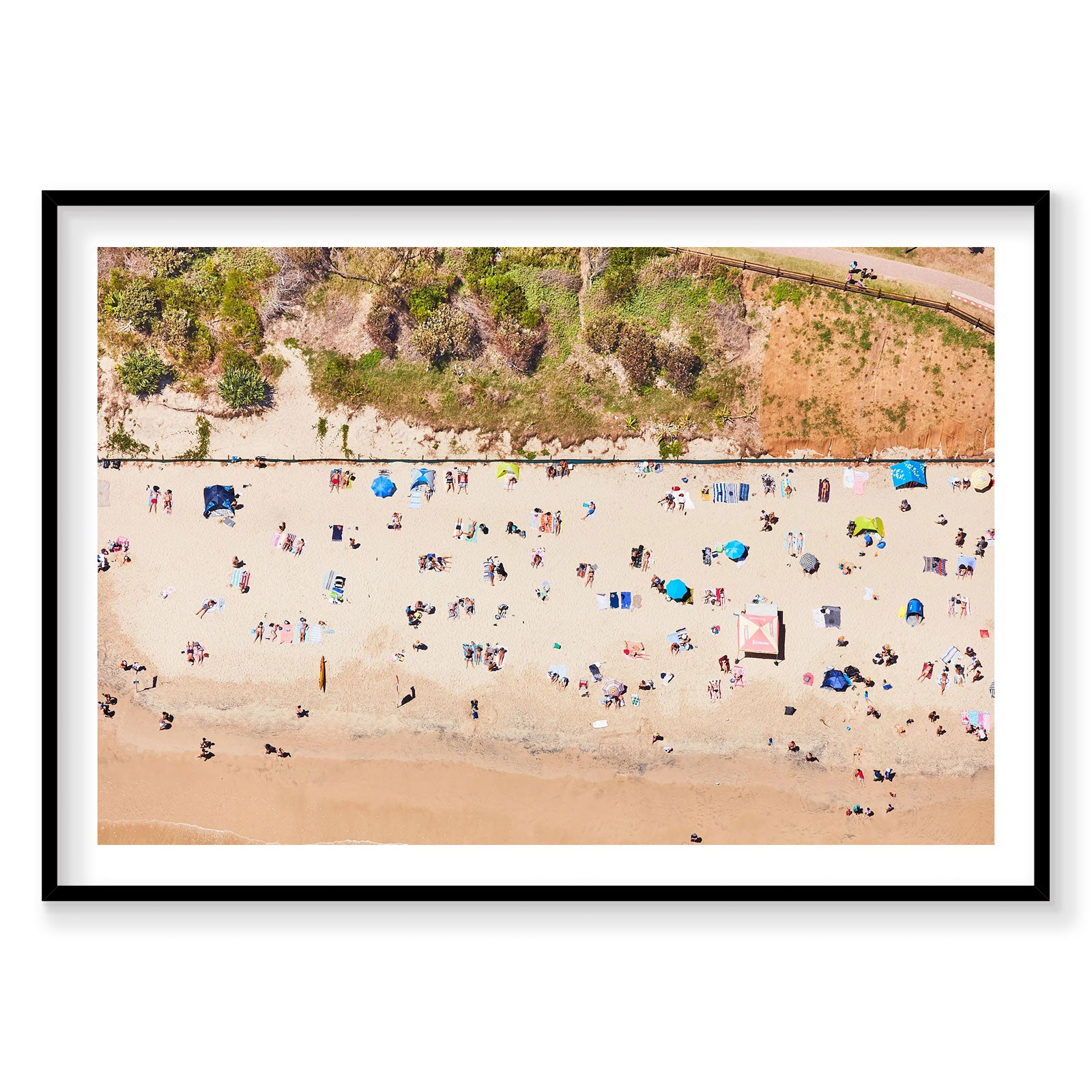 Aerial view of Main Beach Byron Bay with colorful umbrellas and beachgoers, photography print by Remy Gerega