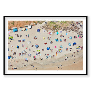 Aerial view of Byron Bay beach with colorful umbrellas and sunbathers scattered on sand, photography print by Remy Gerega