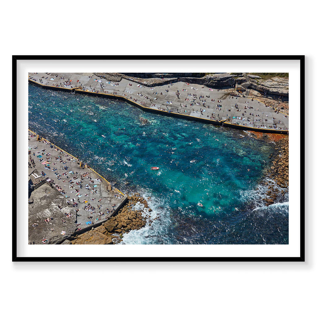 Aerial view of Clovelly Bay with turquoise water and crowded beach coves, photography print by Remy Gerega