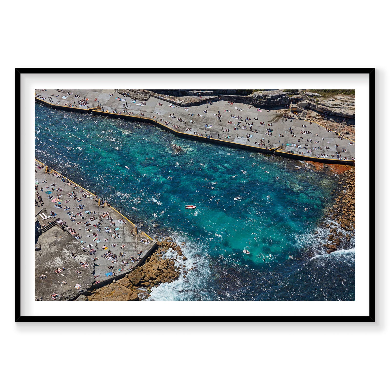 Aerial view of Clovelly Bay with turquoise water and crowded beach coves, photography print by Remy Gerega
