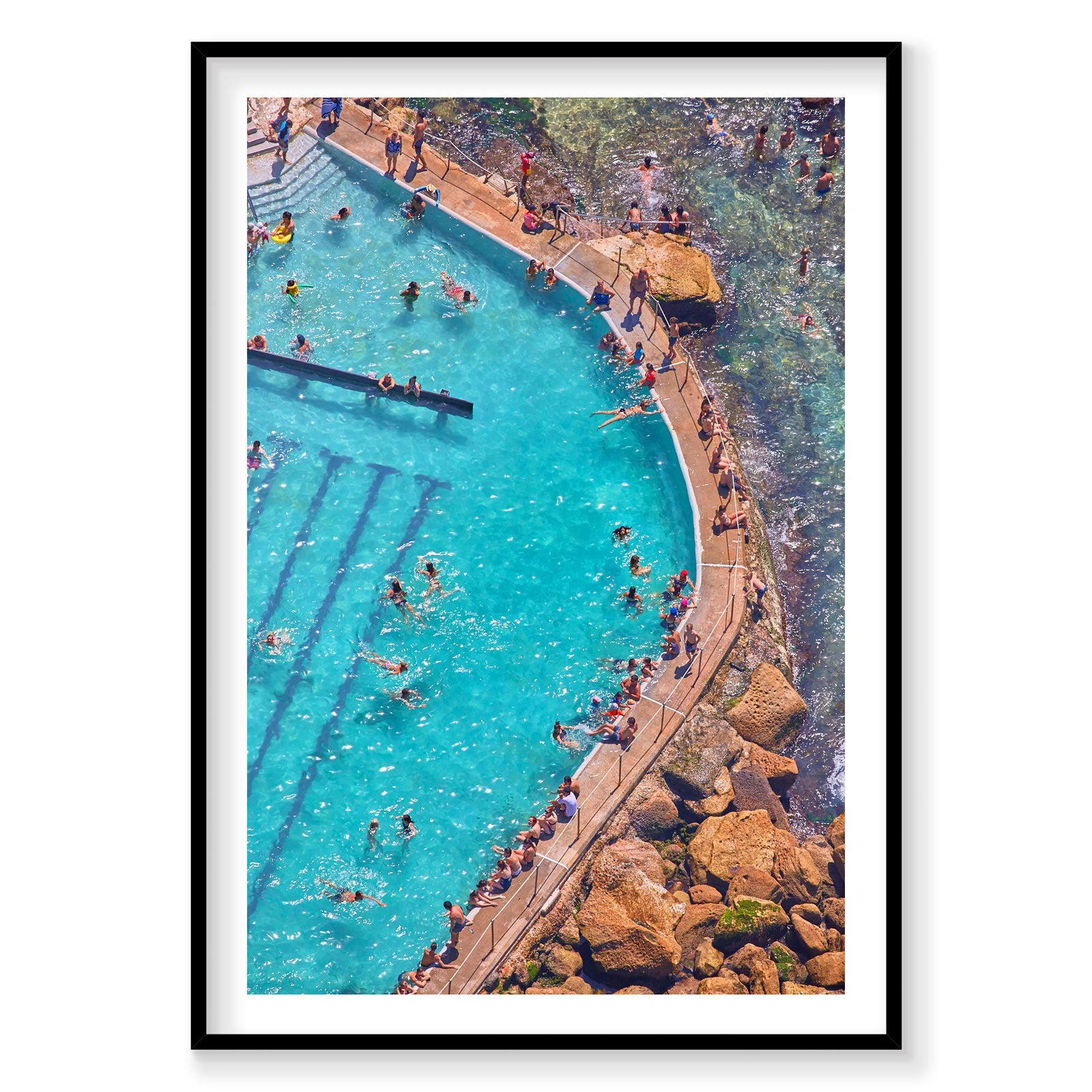 Aerial view of Bronte Baths turquoise pool with swimmers and rocky coastline, photography print by Remy Gerega