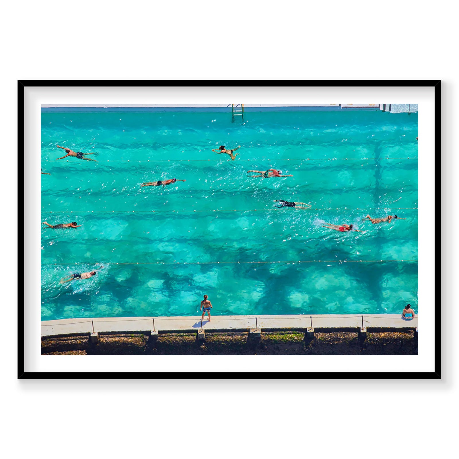 Aerial view of swimmers in turquoise ocean pool with spectators on deck, photography print by Remy Gerega