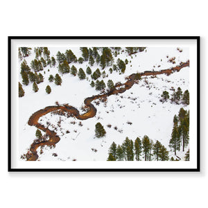 Aerial view of winding river through snowy forest with scattered evergreen trees, Lake Tahoe, photography print by Remy Ge...