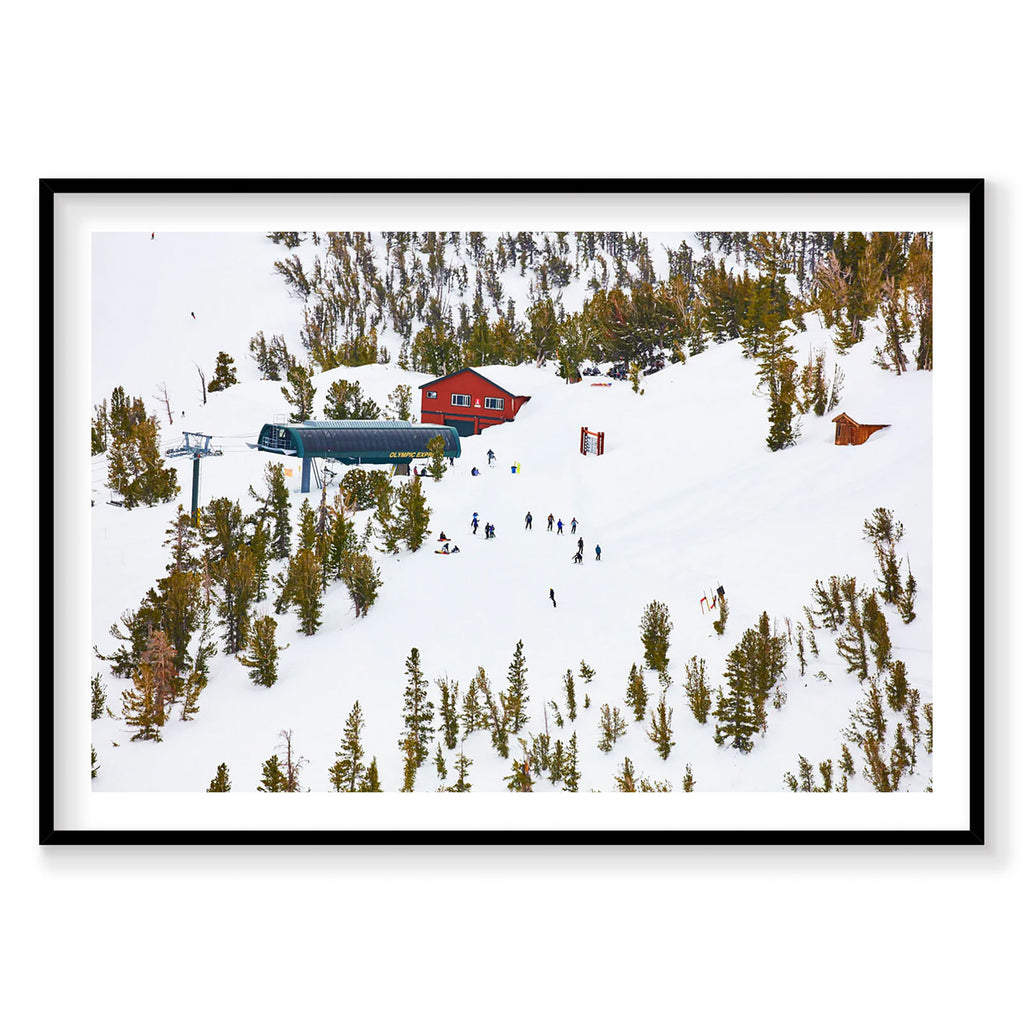 Aerial view of snowy Lake Tahoe ski resort with red lodge and ski lift, photography print by Remy Gerega