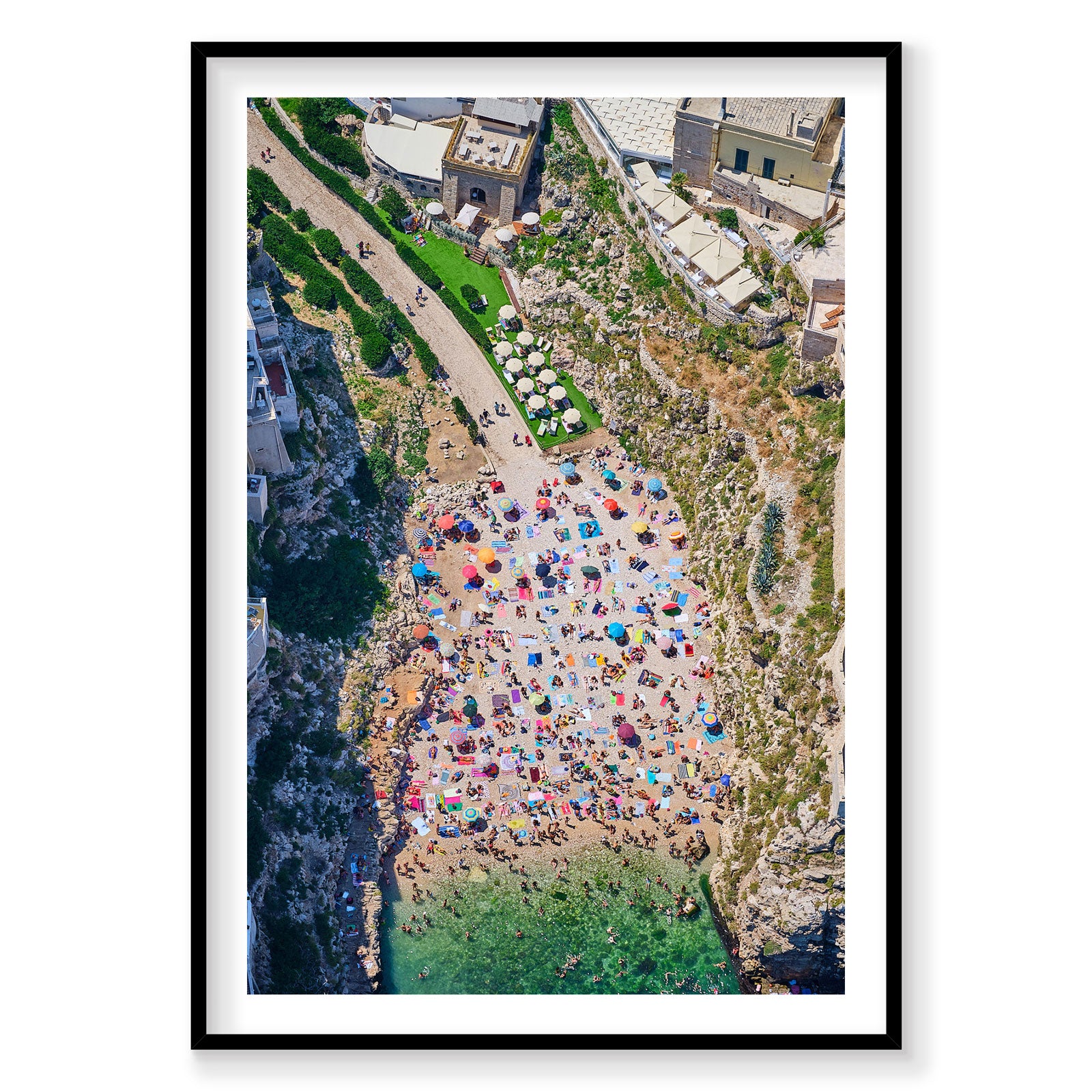 Aerial view of Polignano a Mare beach cove with colorful umbrellas, Italy, photography print by Remy Gerega