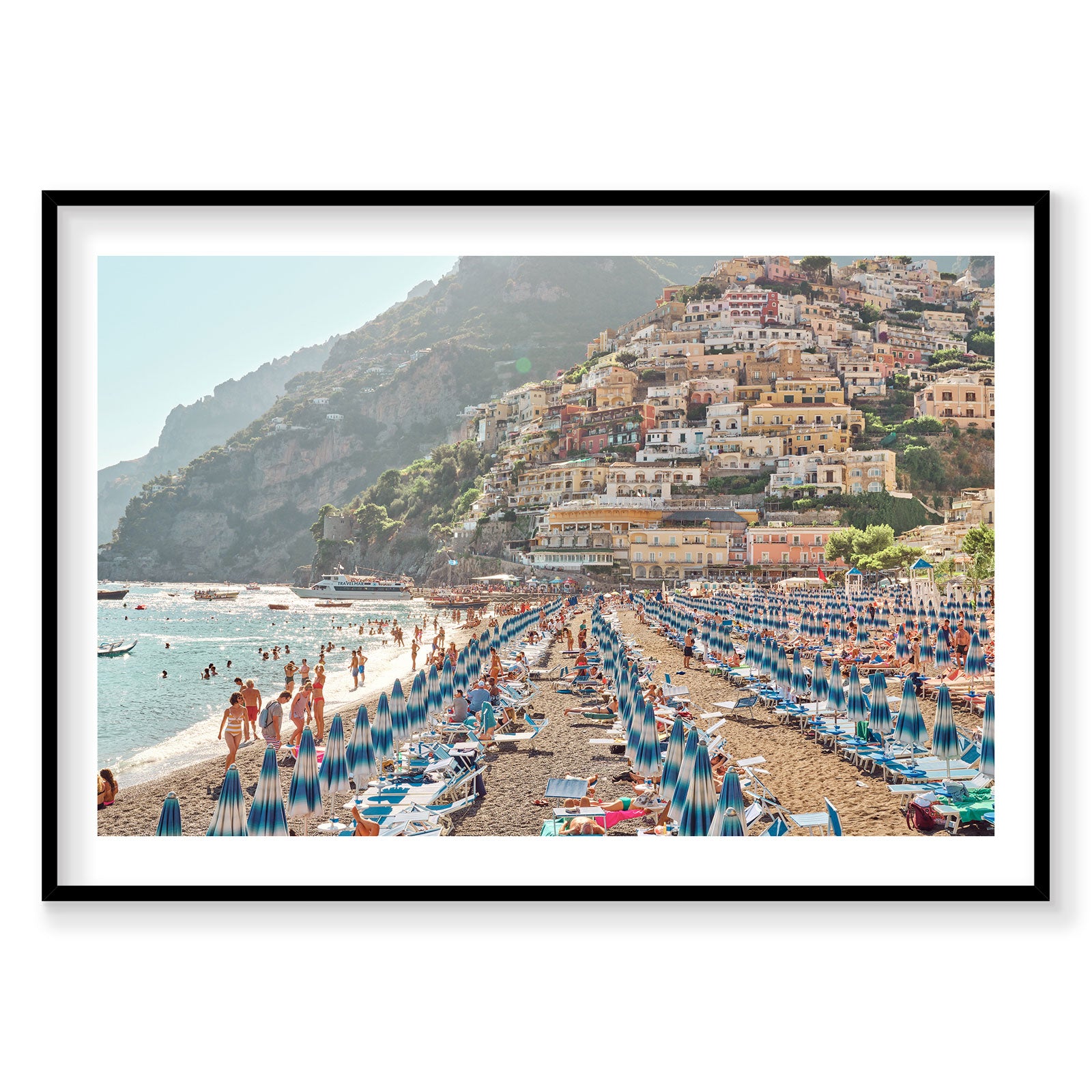 Positano beach with blue umbrellas and colorful cliffside village, Italy, photography print by Remy Gerega