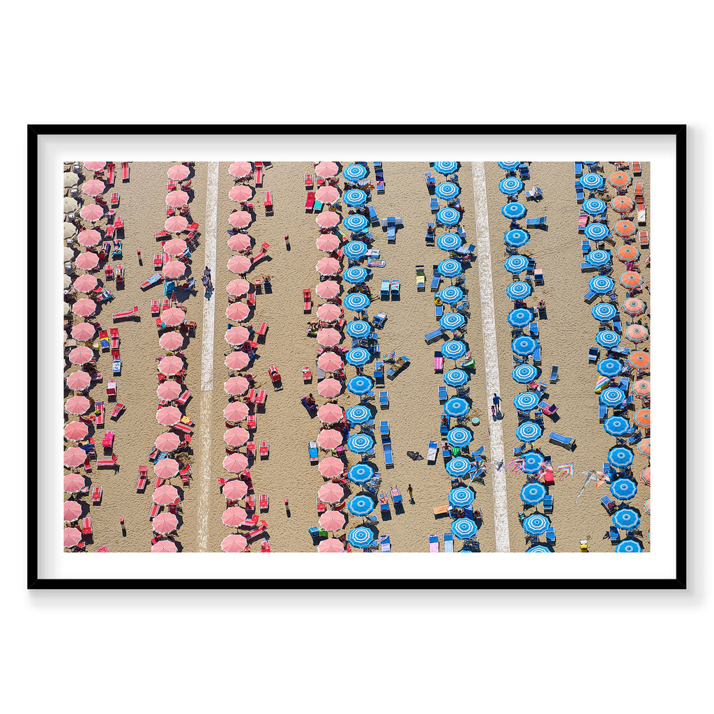 Aerial view of Italian beach with pink and blue umbrellas arranged in rows, photography print by Remy Gerega