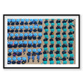 Aerial view of Italian beach with blue and turquoise umbrellas and sunbathers, photography print by Remy Gerega