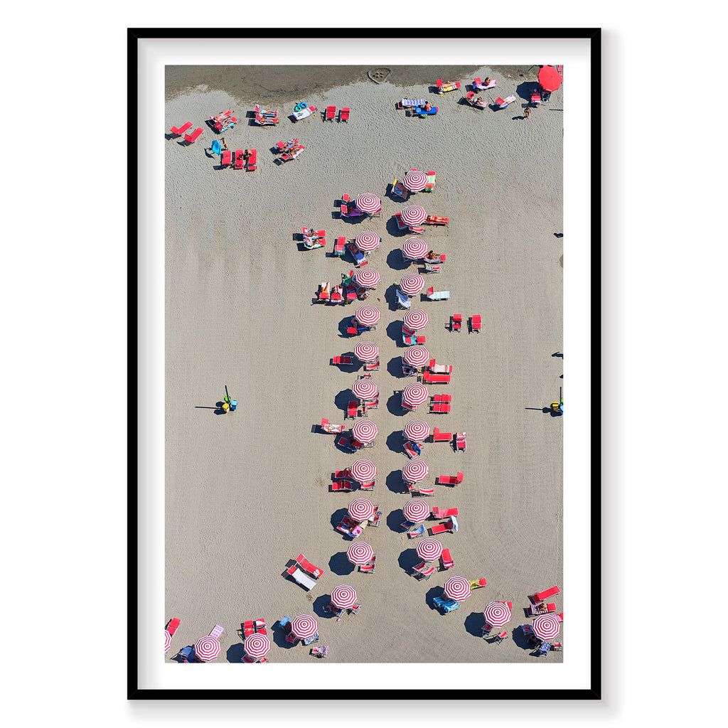 Aerial view of red and white striped beach umbrellas arranged on Italian sand, photography print by Remy Gerega