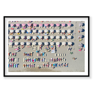 Aerial view of Italian beach with colorful umbrellas and sunbathers arranged in rows, photography print by Remy Gerega