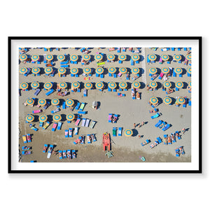 Aerial view of colorful beach umbrellas and sunbathers on Italian sandy beach, photography print by Remy Gerega