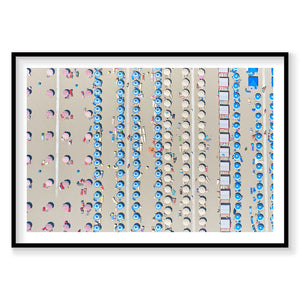 Aerial view of Italian beach with colorful umbrellas and sunbathers arranged in organized rows, photography print by Remy ...