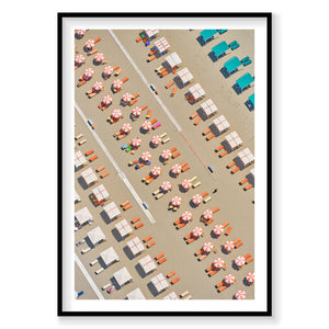 Aerial view of Italian beach with orange lounge chairs and umbrellas, photography print by Remy Gerega