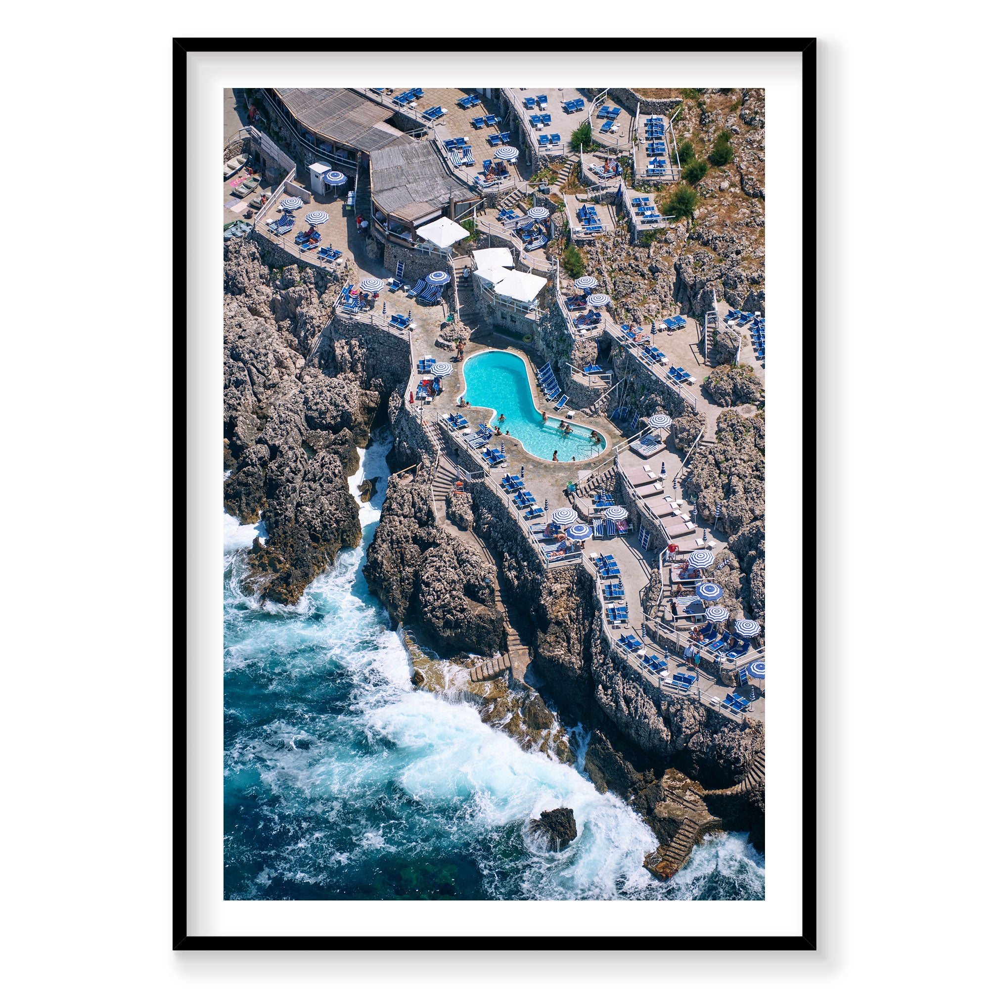 Aerial view of Lido del Faro cliffside pool Italy with turquoise water and ocean waves, photography print by Remy Gerega