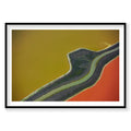 Aerial view of San Francisco Bay salt ponds with bold yellow, orange and green water colors, photography print by Remy Gerega