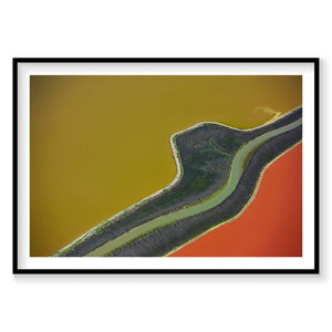 Aerial view of San Francisco Bay salt ponds with bold yellow, orange and green water colors, photography print by Remy Gerega