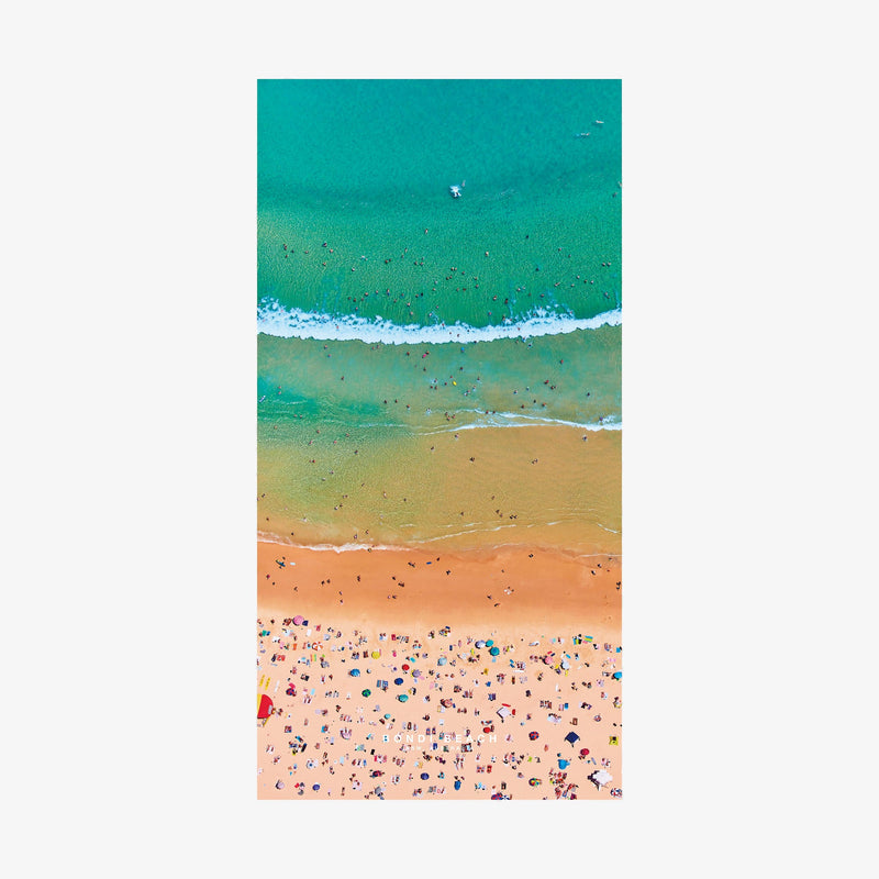 Aerial view of Bondi Beach with turquoise ocean, white waves, and colorful beach umbrellas, quick-dry beach towel by Remy Gerega
