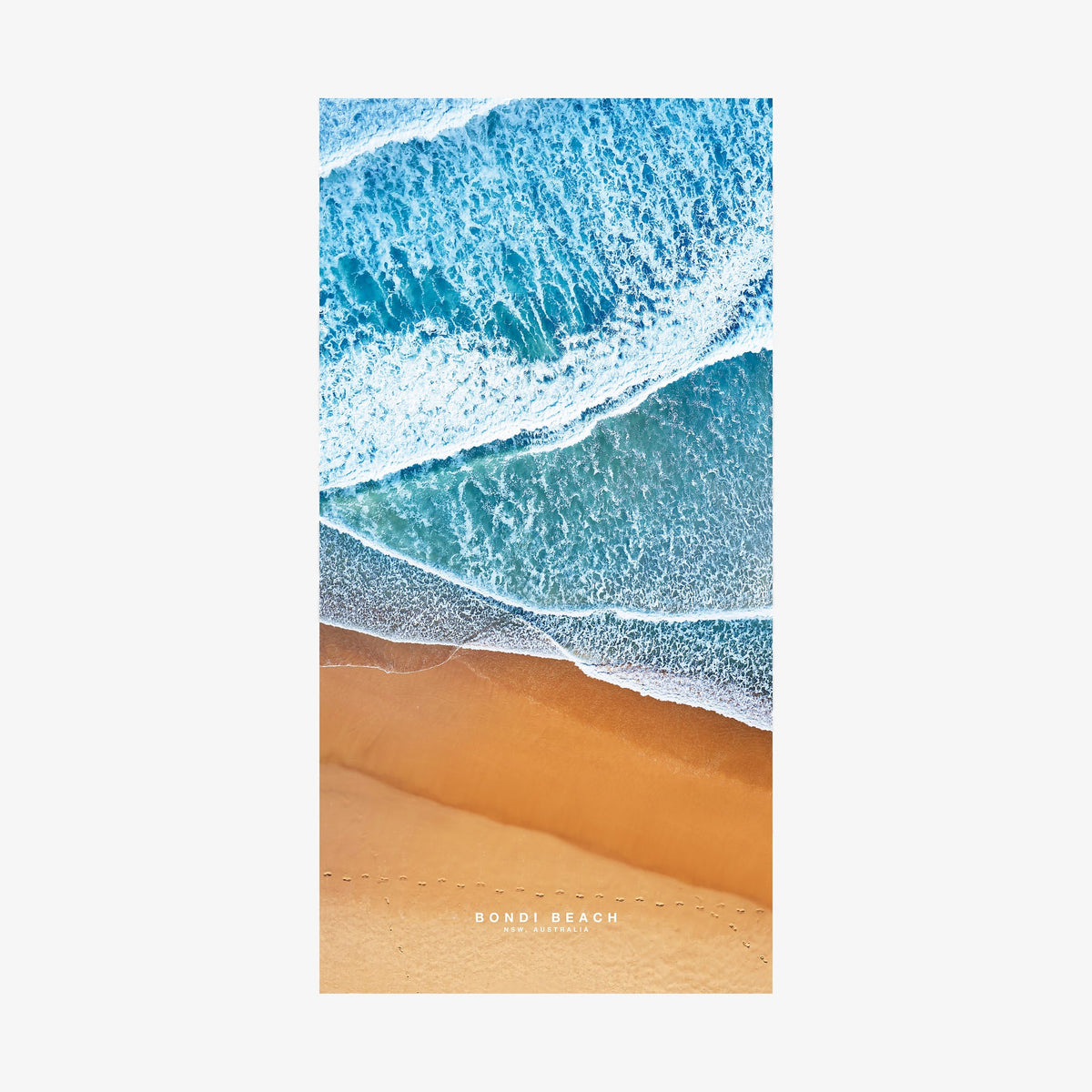 Aerial view of Bondi Beach shoreline with turquoise waves and golden sand, quick-dry beach towel by Remy Gerega