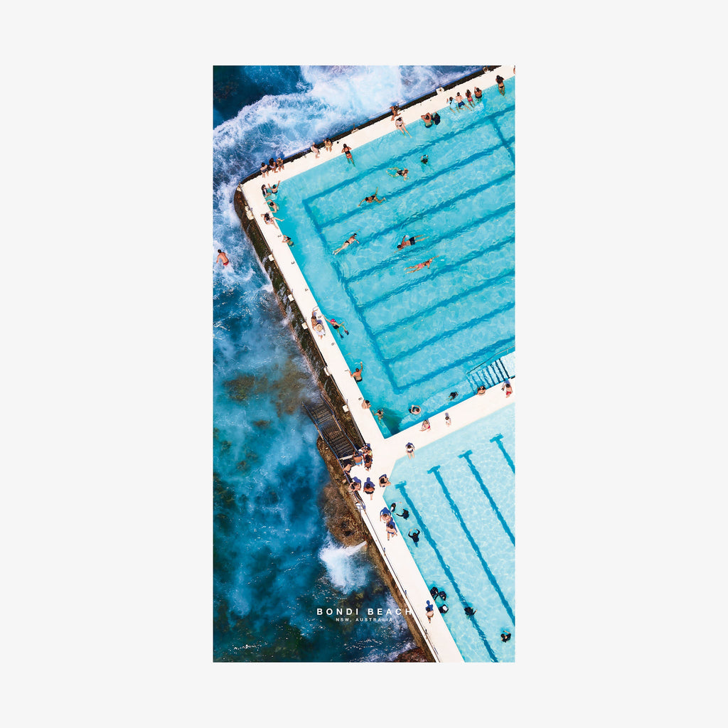 Aerial view of Bondi Beach ocean pool with turquoise water and crashing waves, quick-dry beach towel by Remy Gerega