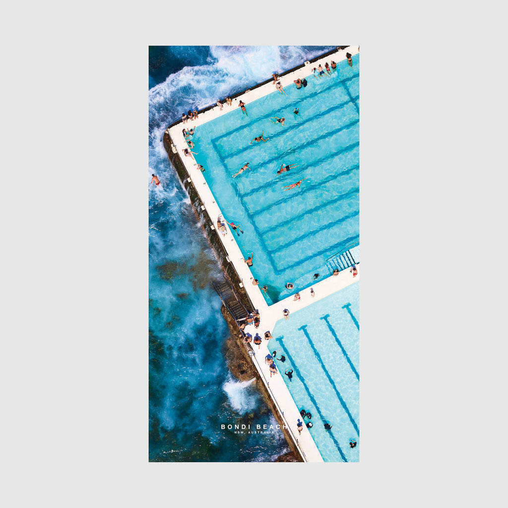 Aerial view of Bondi Beach ocean pool with turquoise water and crashing waves, quick-dry beach towel by Remy Gerega