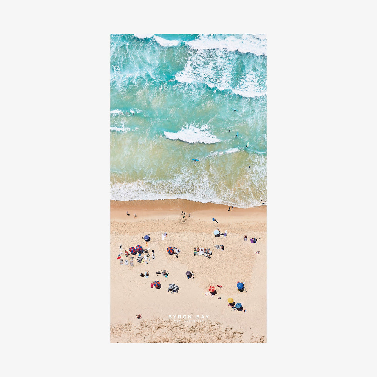 Aerial view of Byron Bay beach with turquoise waves and colorful umbrellas,quick-dry beach towel by Remy Gerega