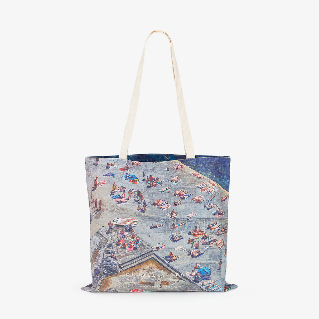 Aerial view of Clovelly Beach crowded with sunbathers and swimmers, canvas tote bag by Remy Gerega