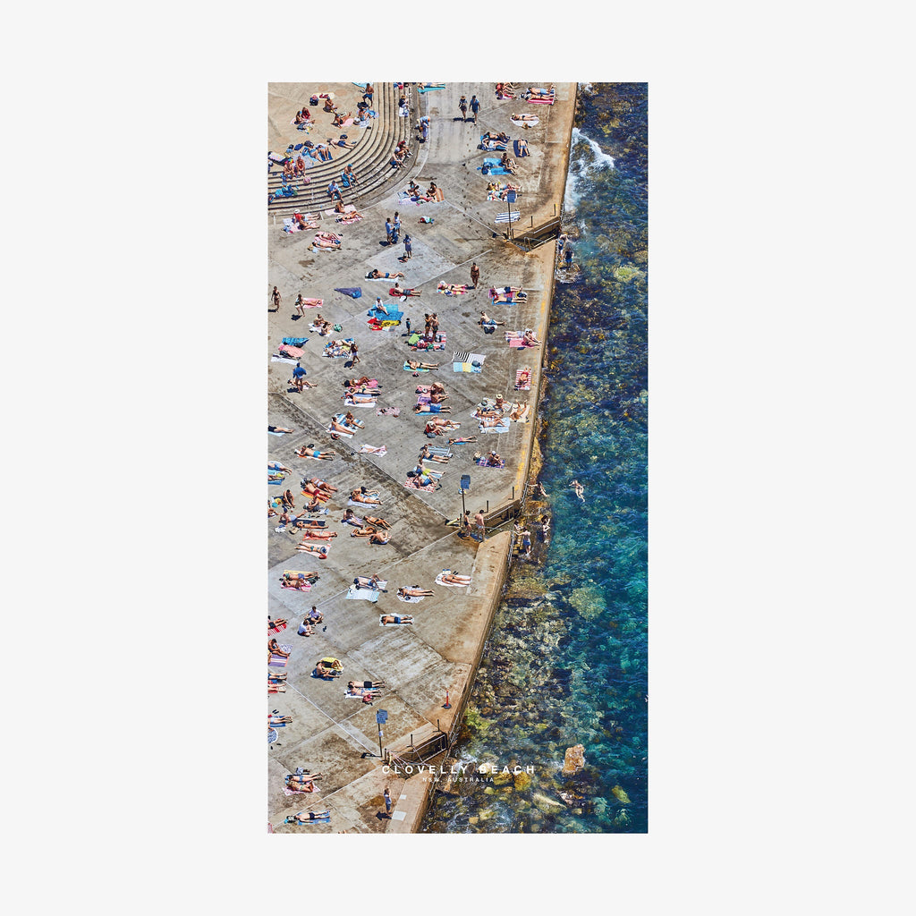 Aerial view of Clovelly Beach Sydney with sunbathers and turquoise water, quick-dry beach towel by Remy Gerega