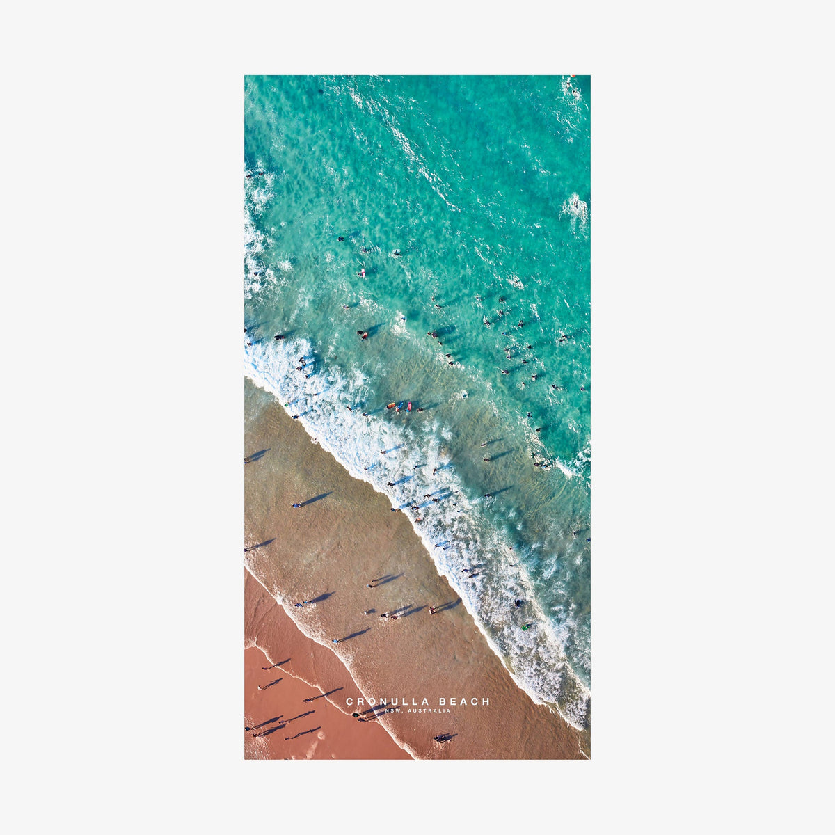 Aerial view of Cronulla Beach with turquoise water, white waves, and red sand, quick-dry beach towel by Remy Gerega