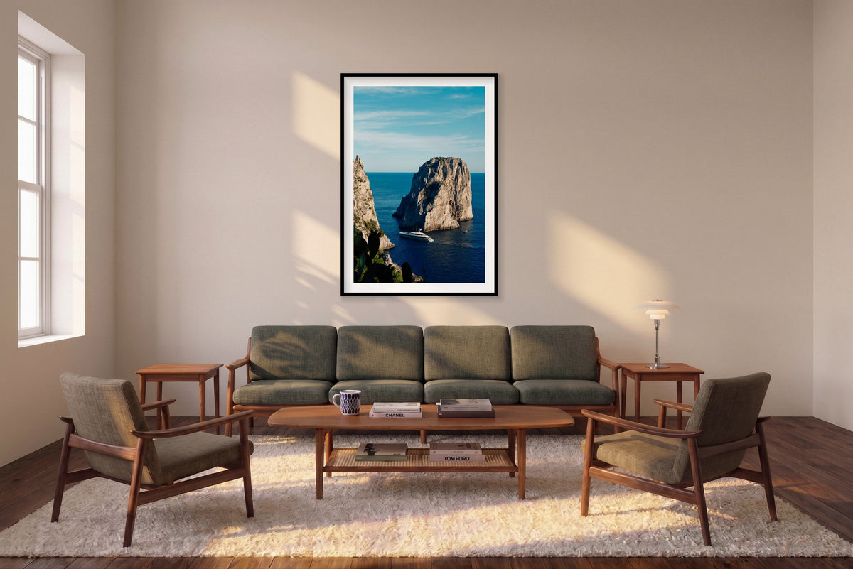 Endeavour 2, Capri vertical photograph in a black frame above a sofa in the room mockup.