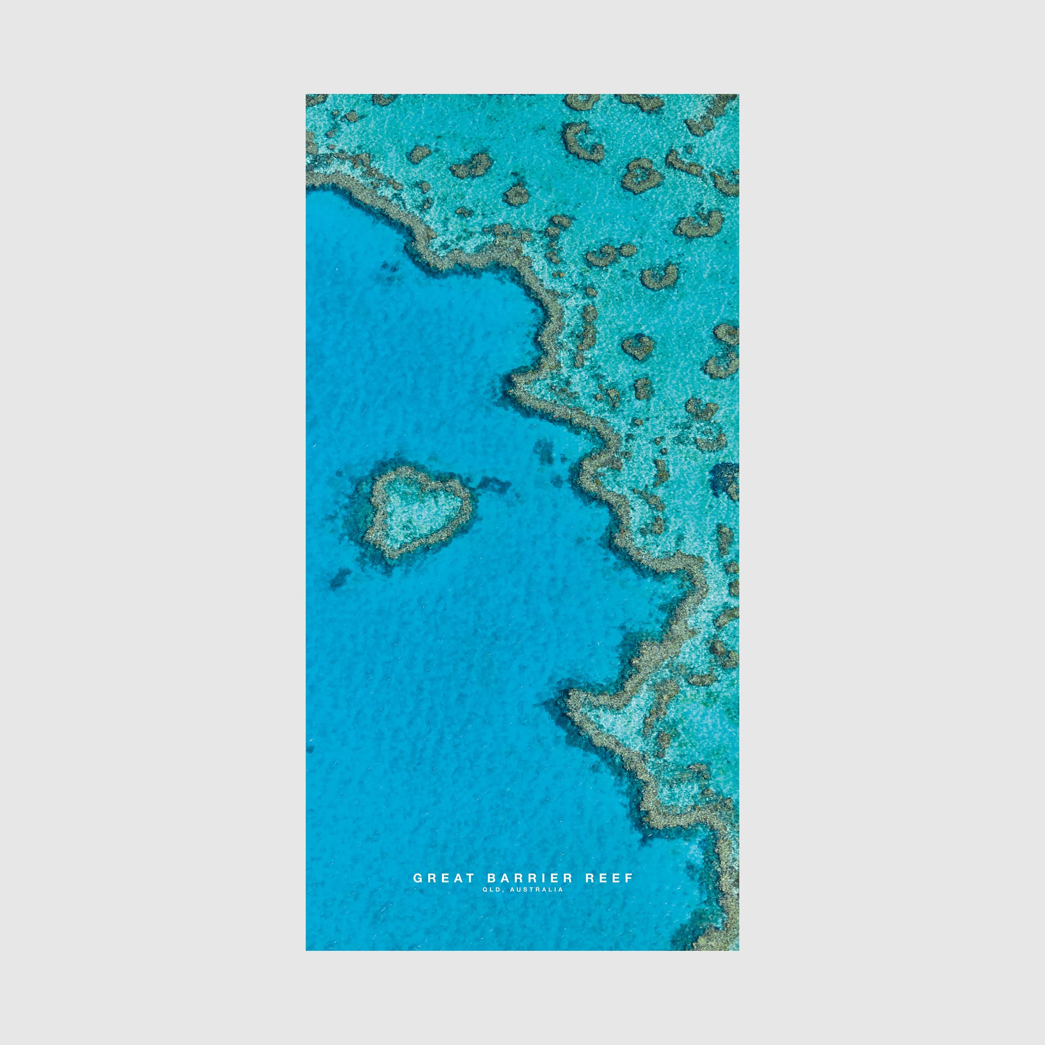 Aerial view of Great Barrier Reef coral formations and turquoise waters, Queensland Australia, quick-dry beach towel by Remy Gerega