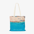 Aerial view of Hamilton Island beach with turquoise water and sandy shore, canvas tote bag by Remy Gerega