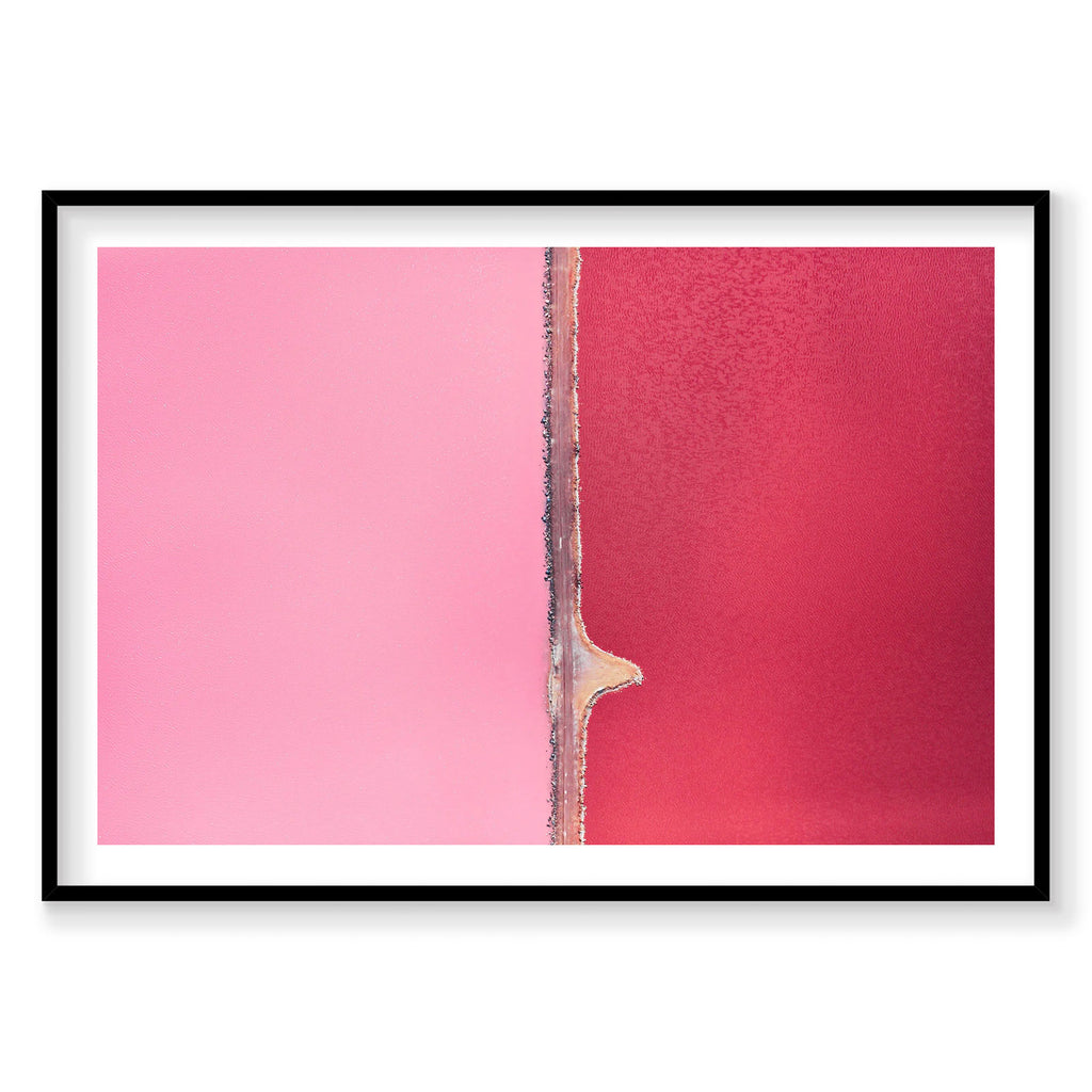 Aerial view of Hutt Lagoon's pink and red waters separated by a narrow causeway, photography print by Remy Gerega