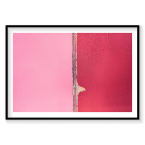 Aerial view of Hutt Lagoon's pink and red waters separated by a narrow causeway, photography print by Remy Gerega