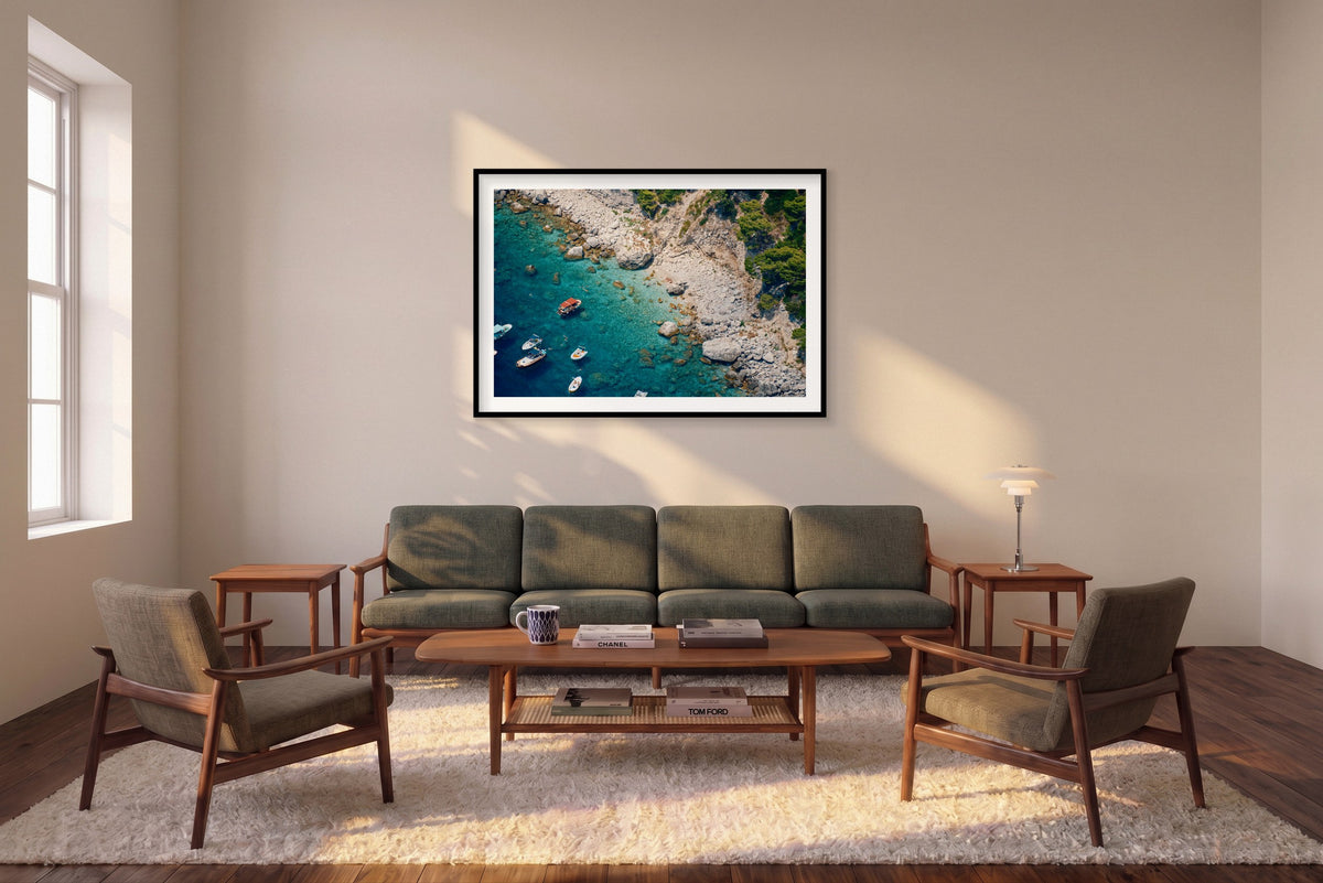 Just One More Swim, Capri horizontal photograph in a black frame above a sofa in the room mockup.