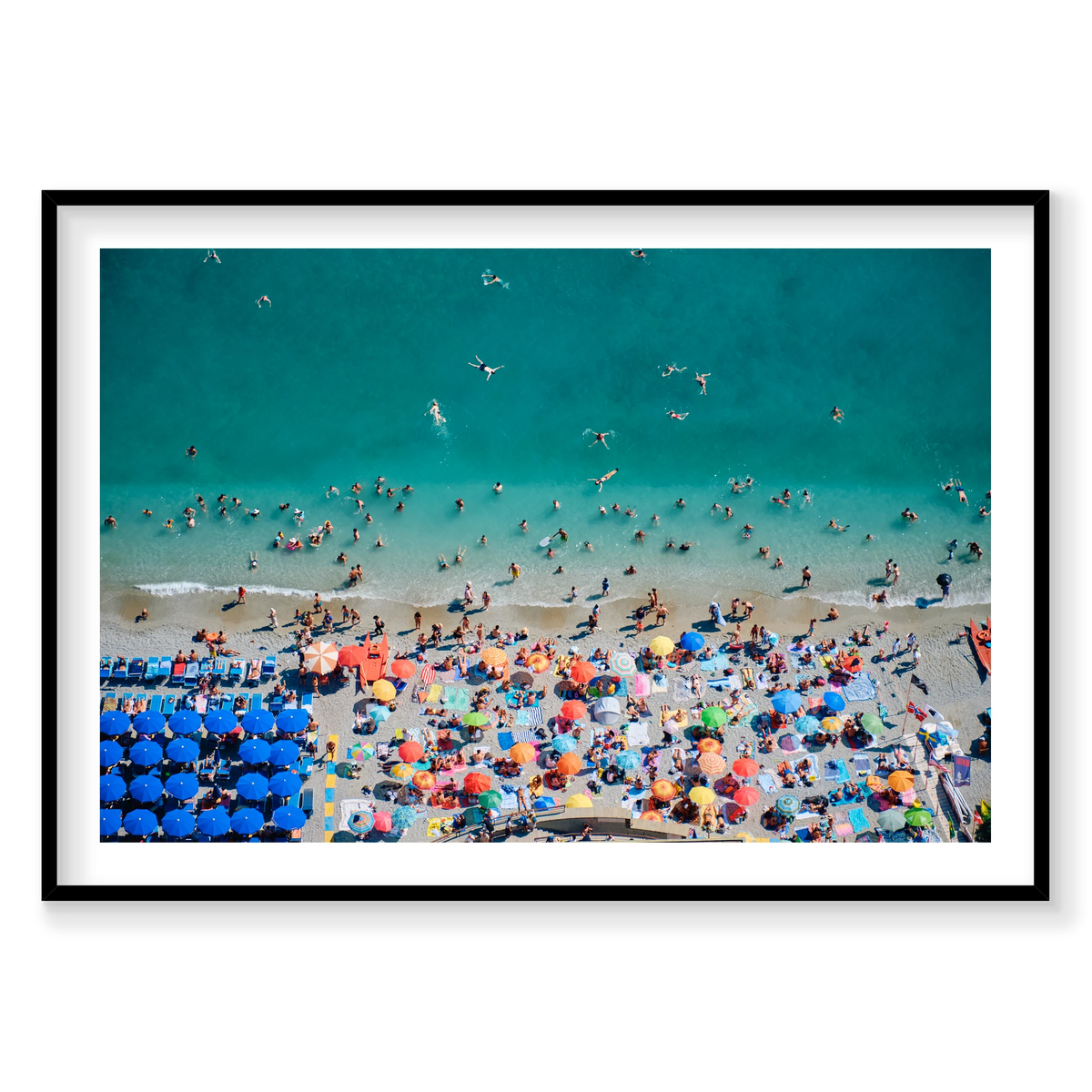 Swimmers in turquoise water beside colourful beach umbrellas at Monterosso al Mare, Cinque Terre, Italy, black frame.